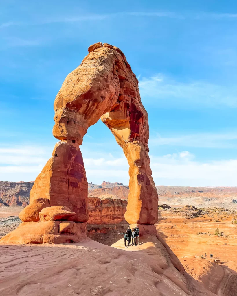 Family standing under delicate arch