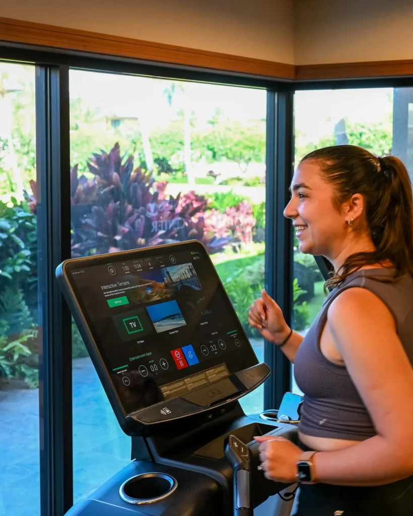 girl smiling on treadmill